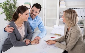 Professional business meeting: young couple as customers and an